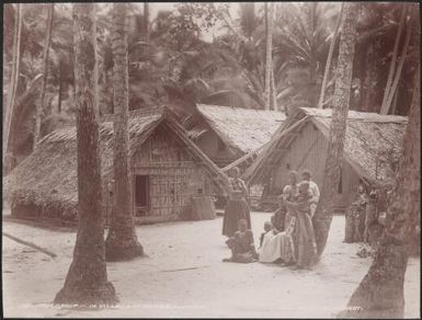 Women and children in the village of Kombe, Florida, Solomon Islands, 1906 / J.W. Beattie