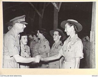 LAE AREA, NEW GUINEA, 1945-06-28. HIS ROYAL HIGHNESS, THE DUKE OF GLOUCESTER, GOVERNOR GENERAL OF AUSTRALIA (1) MEETING OFFICERS AT THE AUSTRALIAN WOMEN'S ARMY SERVICE BARRACKS DURING HIS TOUR OF ..