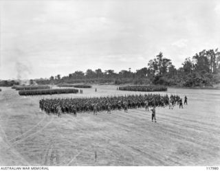 TOROKINA, BOUGAINVILLE. 1945-10-29. PERSONNEL OF 15TH INFANTRY BATTALION GIVE EYES RIGHT TO THE COMMANDER IN CHIEF, AUSTRALIAN MILITARY FORCES, DURING THE MARCH PAST OF 3RD DIVISION ON THE PIVA ..