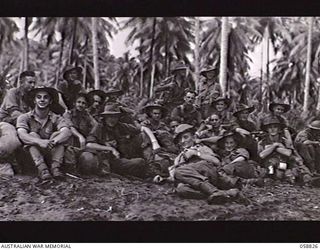 LANGEMAK BAY, NEW GUINEA. 1943-10-20. PERSONNEL OF THE 2/11TH AUSTRALIAN FIELD AMBULANCE RESTING ON THE BEACH WHILE WAITING FOR THEIR EMBARKATION ORDERS