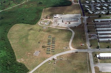 Aerial view the Tent City living facilities for deployed US Military personnel at Agana Naval Air Station, Guam during Exercise TANDEM TRHUST 99