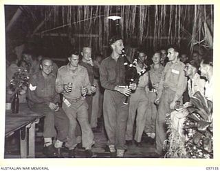 LAE AREA, NEW GUINEA. 1945-09-21. A FAREWELL DINNER WAS HELD IN THE SERGEANTS' MESS, 2/7 ADVANCED WORKSHOP, TO MARK THE UNIT'S CHANGE-OVER WITH 2/1 ADVANCED WORKSHOP. SHOWN, SERGEANTS AND THEIR ..