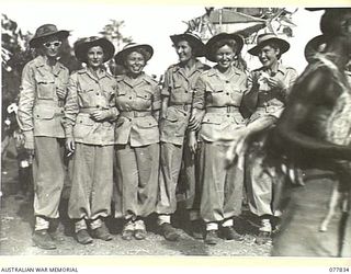 MALAHANG, LAE, NEW GUINEA. 1944-12-25. A GROUP OF MEMBERS OF THE AUSTRALIAN ARMY MEDICAL WOMEN'S SERVICE WHO ATTENDED THE NATIVE SING-SING AT THE AUSTRALIAN NEW GUINEA ADMINISTRATIVE UNIT NATIVE ..