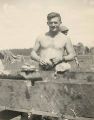 Jack Agnew filling a canteen on Guadalcanal, 1940s