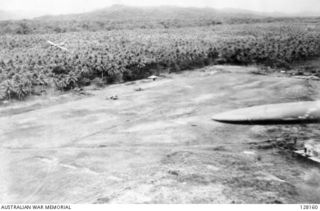 LAE, NEW GUINEA. 1943-03-04. A SURPRISE STRAFING ATTACK BY FLIGHT LIEUTENANT R. F. UREN AND FLYING OFFICER R. H. ROE (RAAF) ON MALAHANG AIRFIELD, IN WHICH SIX JAPANESE ZEROS AND ONE REFUELLING ..