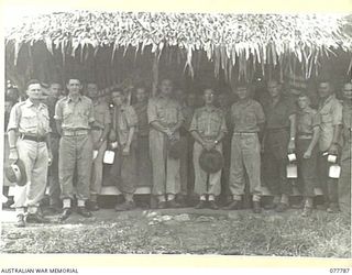 LAE BASE AREA, NEW GUINEA. 1944-12-24. PERSONNEL OF HEADQUARTERS, FIRST AUSTRALIAN ARMY OUTSIDE ONE OF THE UNIT MESSES