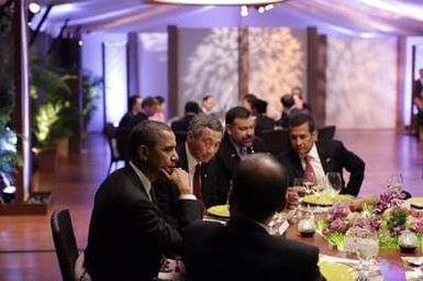 Barack Obama and Michelle Obama attend the Leaders Dinner at the APEC summit in Honolulu, Hawaii, November 12, 2011