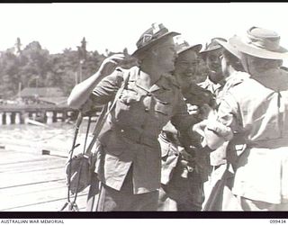 MILFORD HAVEN, NEW GUINEA, 1945-12-14. MEMBERS OF THE AUSTRALIAN ARMY NURSING SERVICE SAYING FAREWELL TO FRIENDS BEFORE EMBARKING ON THE AUSTRALIAN TROOPSHIP SS MANUNDA