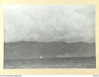 MILNE BAY, NEW GUINEA. 1943-01. JAPANESE AIRCRAFT ATTACKING ALLIED SHIPPING IN THE BAY