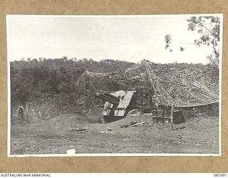 DONADABU AREA, NEW GUINEA. 1943-12-01. NO. 1 GUN OF A TROOP, NO. 7 BATTERY, 2/4TH AUSTRALIAN FIELD REGIMENT IN ACTION DURING THE COMBINED EXERCISES WITH THE 2/10TH AUSTRALIAN INFANTRY BATTALION