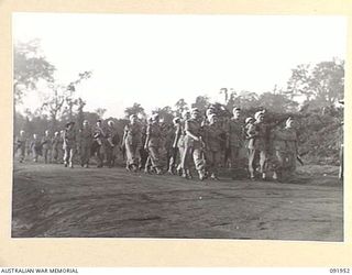 TOROKINA, BOUGAINVILLE, 1945-04-18. MEMBERS OF AUSTRALIAN ARMY NURSING SERVICE FROM 2/1 GENERAL HOSPITAL DAY STAFF GOING ON DUTY AT 0700 HOURS (7 O'CLOCK)