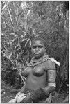 Courtship: adolescent girl wears strands of trade beads and other finery, dressed up for courtship event