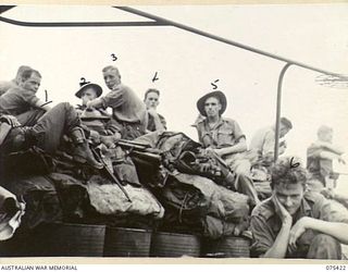 POTSDAM, NEW GUINEA. 1944-08-21. TROOPS OF THE 30TH INFANTRY BATTALION ON TOP OF THEIR GEAR ABOARD THE RAN FRIGATE, HMAS "BARCOO" WHICH IS CARRYING THEM FROM HANSA BAY TO ALEXISHAFEN