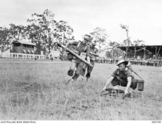 WONDECLA, ATHERTON TABLELAND, QLD. 1945-01-19. BEACH GROUP, 2/2 PIONEER BATTALION TROOPS IN ACTION DURING THE 3 INCH MORTAR CONTEST. THE MEN ARE PARTICIPATING IN THE 9 DIVISION GYMKHANA AND RACE ..