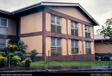 Vanuatu - Orange building, white shutters