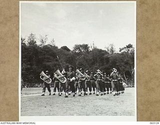 ELA BEACH, NEW GUINEA. 1944-01-01. THE 18TH INFANTRY BRIGADE BAND, WINNERS OF THE BAND MARCHING CONTEST AT THE ALLIED SERVICES GRAND SPORTS CARNIVAL