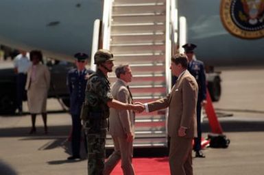 President Ronald Reagan shakes hands with Lieutenant Colonel Eugene Bernhardt, commander of the 1ST Battalion, 25th Infantry Division, prior to boarding Air Force One. The president and first lady are visiting Hawaii while en route to the Republic of China