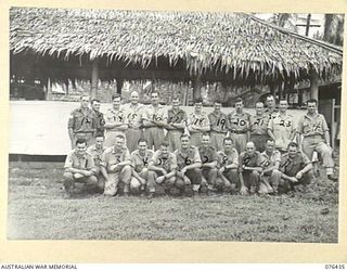 LAE, NEW GUINEA. 1944-10-04. SENIOR NON COMMISSIONED OFFICERS OUTSIDE THEIR MESS AT THE AUSTRALIAN ARMY CANTEENS SERVICE BULK STORE, NEW GUINEA DETACHMENT. IDENTIFIED PERSONNEL ARE:- NX175123 ..