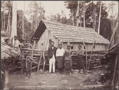 Men and children at the church in Qarea, Malaita, Solomon Islands, 1906 / J.W. Beattie