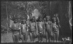 Mafulu women and girls of Deva Deva village, in mountains of Central Province, with shell jewelry; woman on left holding young pig