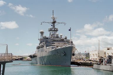 Starboard bow view of the miscellaneous command ship USS CORONADA (AFG 11) tied up at the Merry Point landing. The ship is taking part in Operation RIMPAC 2000