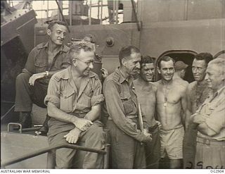 NEAR BRUNEI BAY, BORNEO. 1945-06-09. VETERANS OF TWO OTHER AMPHIBIOUS INVASIONS, AT TADJI AND AT NOEMFOOR, THESE MEMBERS OF NO. 61 AIRFIELD CONSTRUCTION WING RAAF LOOKED ON THE LABUAN ASSAULT AS ..