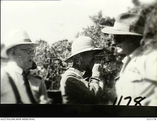 AITAPE, NORTH EAST NEW GUINEA. C. 1944-06. LEFT TO RIGHT: ARTHUR DRAKEFORD, THE MINISTER FOR AIR, JOHN DEDMAN, THE MINISTER FOR WAR ORGANISATION OF INDUSTRY, AND AIR COMMODORE F. R. W. SCHERGER, ..