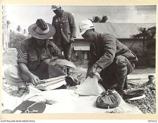 OCEAN ISLAND. 1945-10-02. FOLLOWING THE SURRENDER OF THE JAPANESE, TROOPS OF 31/51 INFANTRY BATTALION OCCUPIED THE ISLAND AND JAPANESE TROOPS WERE EVACUATED TO TOROKINA. SHOWN, JAPANESE BEING ..