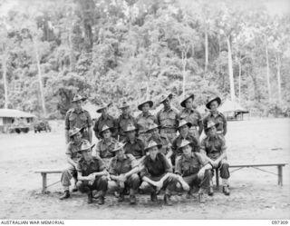 Group portrait of members of 17 Platoon, D Company, 58/59 Infantry Battalion. Identified, back row, left to right: Private (Pte) R Robb; Pte C Johnston; Pte L Sherrington; Pte A Jones; Pte A ..