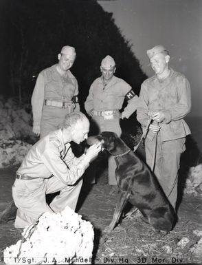Photograph of Ernie Pyle Talking to Jeep, a Scout and Security Patrol Doberman Pinscher