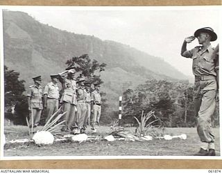 17 MILE, PORT MORESBY AREA, NEW GUINEA. 1943-12-24. VX247 BRIGADIER C. A. STINSON, DEPUTY DIRECTOR OF ORDNANCE SERVICES HEADQUARTERS, NEW GUINEA FORCE (2) TAKING THE SALUTE FORM TROOPS OF THE 10TH ..