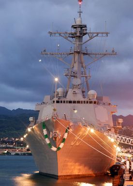 The US Navys (USN) newest and most advanced USN Arleigh Burke Class Guided Missile Destroyer USS CHUNG-HOON (DDG 93), sits moored at Ford Island after arriving at her new homeport of Pearl Harbor, Hawaii (HI). After the arrival, the ships crew will prepare for their commissioning ceremony on September 18th. The ship is named in honor of Rear Admiral (RADM) (upper half) Gordon Paie'a Chung-Hoon, born and raised in Hawaii (HI) and awarded the Navy Cross and Silver Star for gallantry as Commanding Officer (CO) of USN Fletcher Class Destroyer USS SIGSBEE (DD 502) during the Battle of Okinawa. RADM Chung-Hoon was also assigned to USS ARIZONA during the December 7, 1941 attack on Pearl Harbor