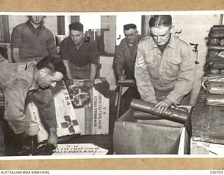 MELBOURNE, AUSTRALIA. 1943-04-09. PACKING WIRING AND STENCILLING CASES OF MEDICAL SUPPLIES FOR DESPATCH FROM LAND HEADQUARTERS DEPOT MEDICAL AND VETERINARY STORES TO FORWARD AREAS IN NEW GUINEA. ..