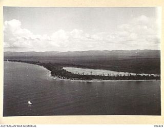 WEWAK AIRSTRIP, NEW GUINEA, 1945-09-12. AERIAL VIEW OF CAPE PUS. TROOPS OF 2/4 INFANTRY BATTALION, OVERCOMING MINOR RESISTANCE, TOOK THIS POINT ON 1945-05-03