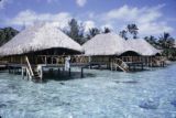 French Polynesia, stilt cabins off shore of Moorea Island