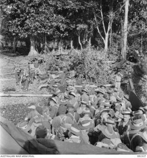 RILE, NEW BRITAIN, 1945-05-10. TROOPS OF 37/52 INFANTRY BATTALION GETTING OFF THE BARGE AT RILE DURING THEIR TREK TO MAVELU, OPEN BAY