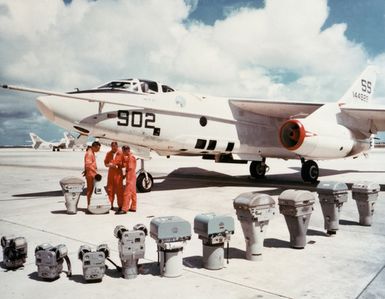 A left front view of an RA-3D Skywarrior aircraft with a display of the camera equipment used aboard it during aerial photographic missions