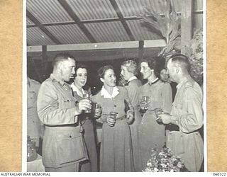 PORT MORESBY, NEW GUINEA. 1943-11-06. AT THE FAREWELL DINNER, HELD AT HEADQUARTERS, NEW GUINEA FORCE, GIVEN TO NX363 LIEUTENANT GENERAL SIR IVEN MACKAY, KBE, CMG, DSO, VD., TO CELEBRATE HIS ..