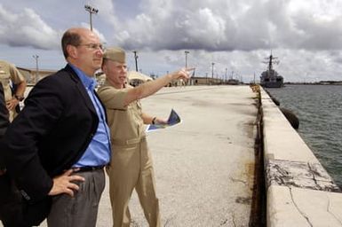 U.S. Navy Rear Adm. Charles Leidig, right, Commander, U.S. Naval Forces Marianas, Navy Region Marianas, gives the Secretary of the Navy (SECNAV), the Honorable Dr. Donald C. Winter, a tour of Naval Base Guam on Aug 25, 2006. The SECNAV is in Guam to get a first-hand look at the work being done by U.S. Navy Sailors and U.S. Marine Corps Marines stationed in the Pacific Region. (U.S. Navy photo by Mass Communication SPECIALIST 1ST Class Shawn P. Eklund) (Released)