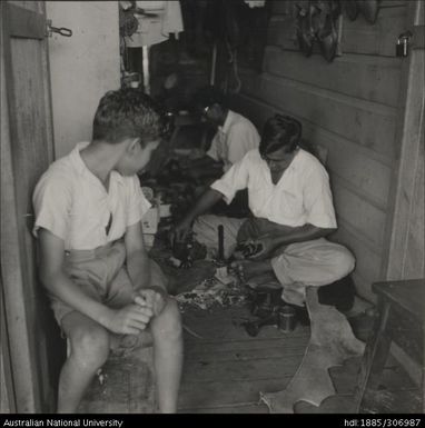 Men fixing shoes