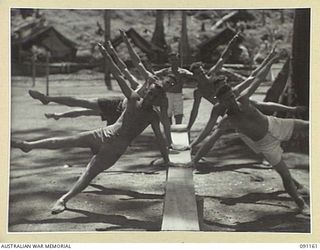TOROKINA, BOUGAINVILLE. 1945-04-19. INSTRUCTORS OF PHYSICAL TRAINING AT 2/3 CONVALESCENT DEPOT TAKE A REFRESHER COURSE BEFORE UNDERTAKING PATIENT CLASSES
