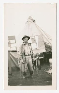 [Soldier Stands in a Flooded Camp]