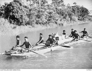 LAKEKAMU RIVER, PAPUA. 1942-07. NATIVES IN DUGOUT CANOES PADDLE UP THE RIVER TO BULLDOG CAMP WITH SUPPLIES FOR KANGA FORCE. SUPPLIES HAD BEEN BROUGHT FROM PORT MORESBY BY THE SCHOONER "ROYAL ..