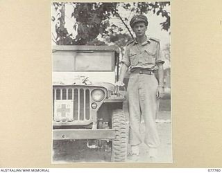 LAE, NEW GUINEA. 1944-12-30. SENIOR REPRESENTATIVE WYSHAM, AUSTRALIAN RED CROSS SOCIETY, WITH HIS JEEP PRIOR TO LEAVING HEADQUARTERS TO DISTRIBUTE COMFORTS TO JAPANESE PRISONERS OF WAR