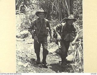 FARIA VALLEY, NEW GUINEA, 1944-02-09. QX27324 PRIVATE A.J. COHEN (1) PICTURED WITH QX30797 PRIVATE F.C. BISHOP (2). BOTH ARE MEMBERS OF THE 2/10TH INFANTRY BATTALION