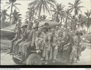 MOMOTE, LOS NEGROS ISLAND, ADMIRALTY ISLANDS. 1944-03-18. GROUND STAFF CREWS OF NO. 76 (KITTYHAWK) SQUADRON RAAF CROWD INTO A JEEP IN A SHORTAGE OF TRANSPORT. BEHIND THEM IS THE AIRCRAFT NICKNAMED ..