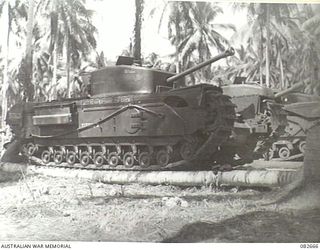 MILILAT, NEW GUINEA. 1944-10-12. CHURCHILL VII TANKS IN THE TANK PARK AT HQ 4 ARMOURED BRIGADE