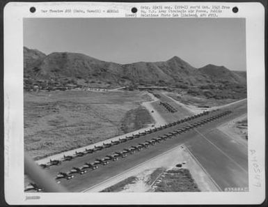 Aerial View Of Inspection Of Republic P-47 'Thunderbolts' Of The 318Th Fighter Group, Prior To Move To Saipan, Marianas Islands. 15 May 1944. Bellows Field, Oahu, Hawaii. (U.S. Air Force Number 63568AC)