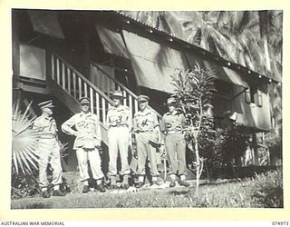 MILILAT, NEW GUINEA. 1944-07-26. VX27 MAJOR GENERAL A.H. RAMSAY, CBE, DSO, ED, GENERAL OFFICER COMMANIDNG, 5TH DIVISION (1) AND SENIOR OFFICERS OUTSIDE THE GENERAL'S HEADQUARTERS. IDENTIFIED ..