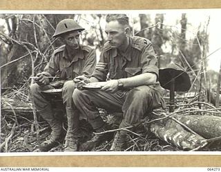 FINISTERRE RANGES, NEW GUINEA. 1944-01-23. QX37895 CORPORAL J.P. WALDIE (1) AND QX13779 SERGEANT R.A. MCDOWELL (2) NON COMMISSIONED OFFICERS, WHO LED NO. 9 PLATOON, "A" COMPANY, 2/9TH INFANTRY ..